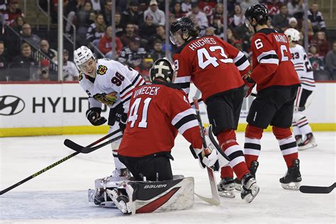 Connor Bedard leaves after Brendan Smith hit as Chicago Blackhawks lose 4-2 to New Jersey Devils